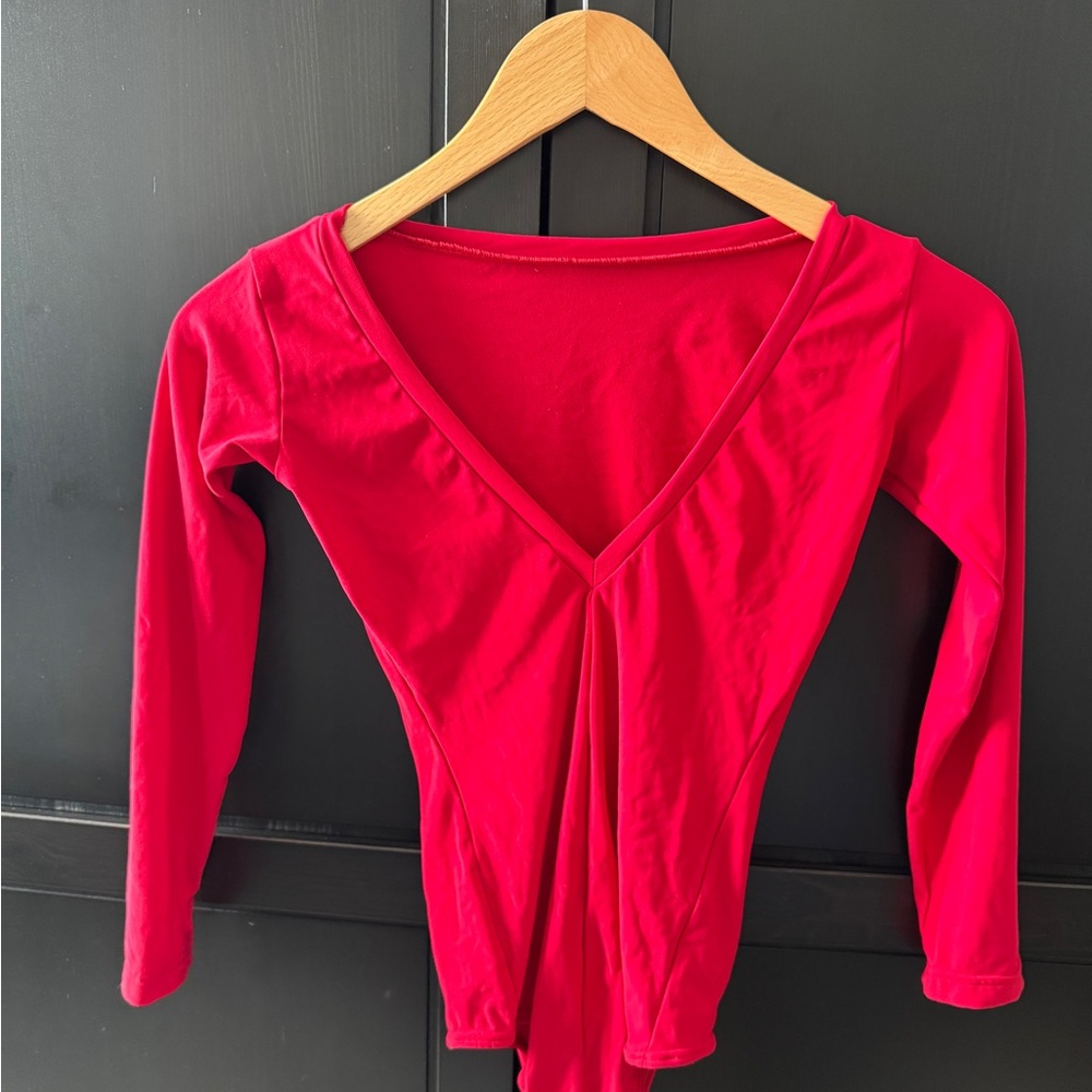 Red 3/4 sleeve Sector 4 leotard from Sweden. Boat neck, V-back.